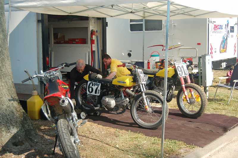 DuQuoin 2006 011.JPG - Mike & Scott Landrum working on their bikes.  They're regulars in our race program.  Mike is an ex-pro rider; Scott, his son, is a high school teacher.
